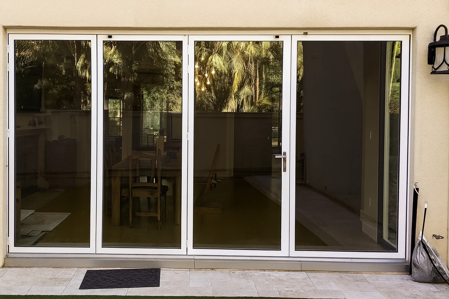 High-quality residential window tinting installed on modern home glass doors for improved privacy and sun protection.